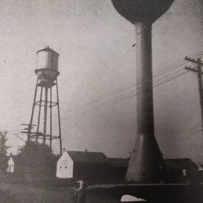 Image of one old water tower and the new water tower design