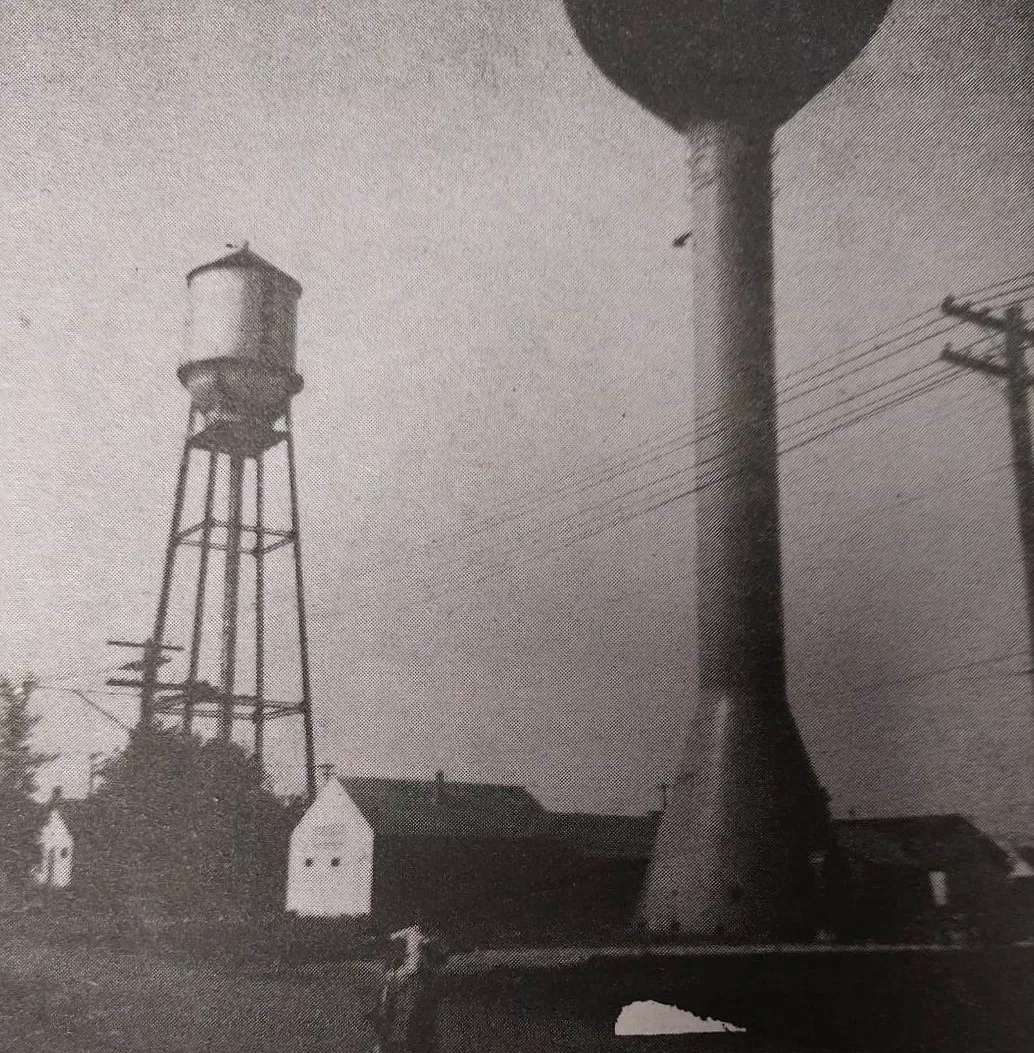 Image of one old water tower and the new water tower design