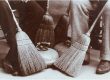Heritage picture of people sitting by a curling rock in the early 1900s.