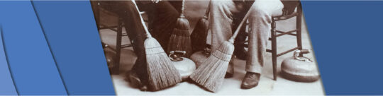 Curling Club Banner Heritage picture of people sitting by a curling rock in the early 1900s.