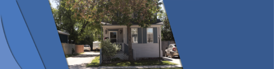 Photo shows a frontal view of 202 Vaughn Avenue. A smaller style home.