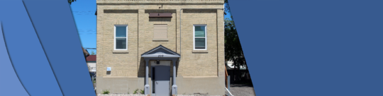 209 eaton (masonic hall) Photo shows the front of the Eaton Masonic Hall. The front door overhang supported by two pillars. Two windows on either side of the building