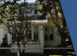Photo shows the front of Gibbs House with trees in front of the house.