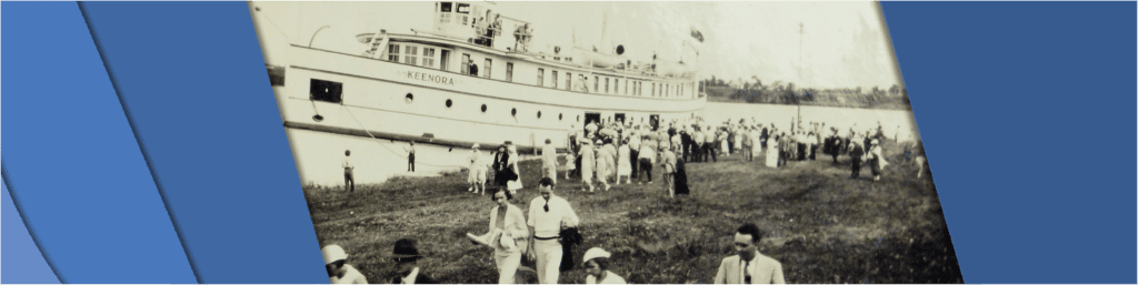 Photo shows passengers getting off of the SS Keenora onto land.