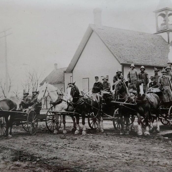 First Fire Wagons, 1906, Ted Wozny Black and white portrait of the first fire wagons in 1906