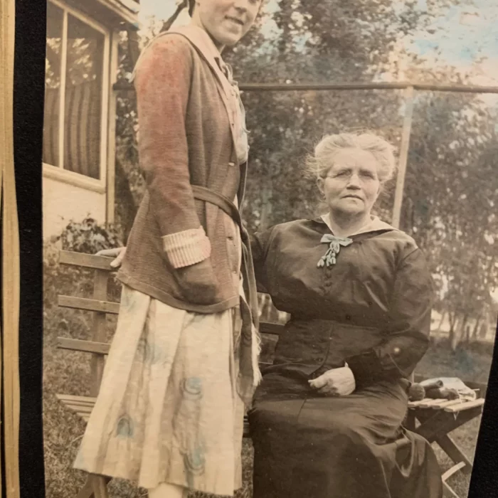 Ruth Hooker in Colour, Date Unknown, Joen Hadfield Two women looking towards the camera. The older women is sitting, the younger women is standing.