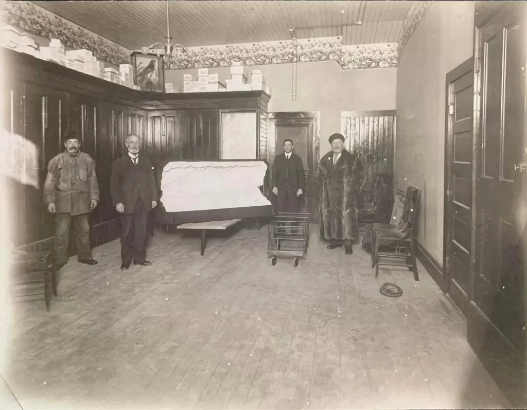 Inside the Moody funeral home, four men standing inside the room