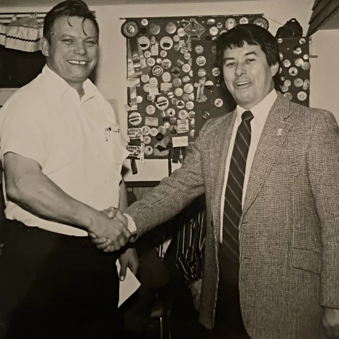 Bill Shead Congratulates New Mayor, Bud Oliver, 1983, Selkirk Enterprise Mayor Bud Oliver shaking hands with Bill Shead