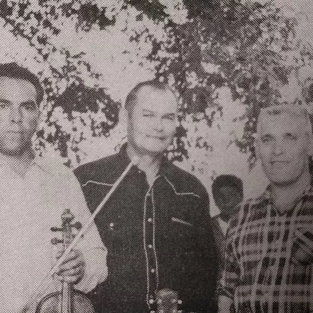 Fiddling at the Fair Days, 1967, Selkirk Enterprise Centennial Edition Black and white portrait of men with their instruments at the Selkirk fair and rodeo