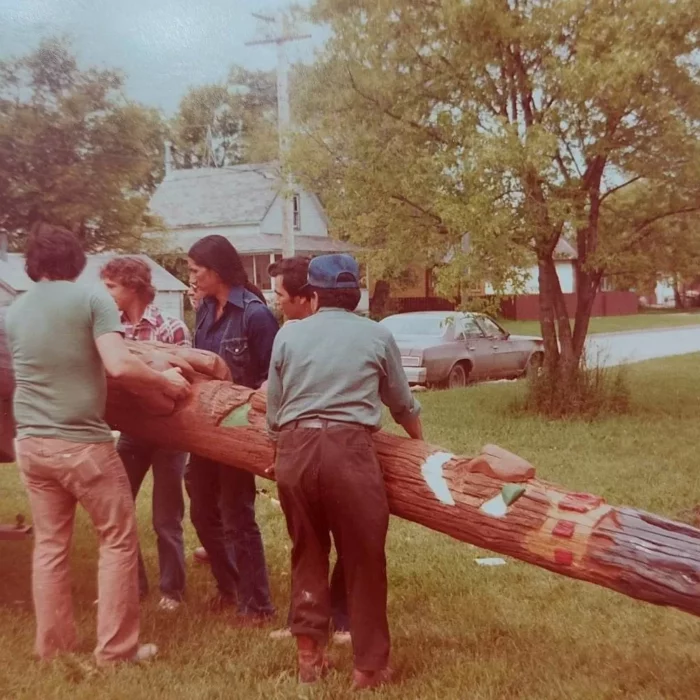 Unloading the Totem Pole, c1970, Selkirk Friendship Centre Five men unloading a totem pole from a truck