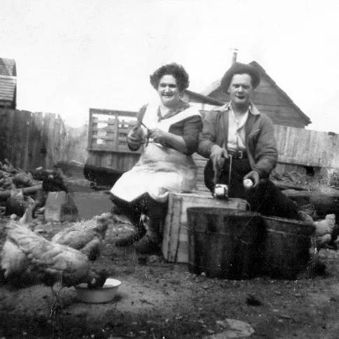 Black and white portrait of Freda and Harry Rifkin peeling potatoes