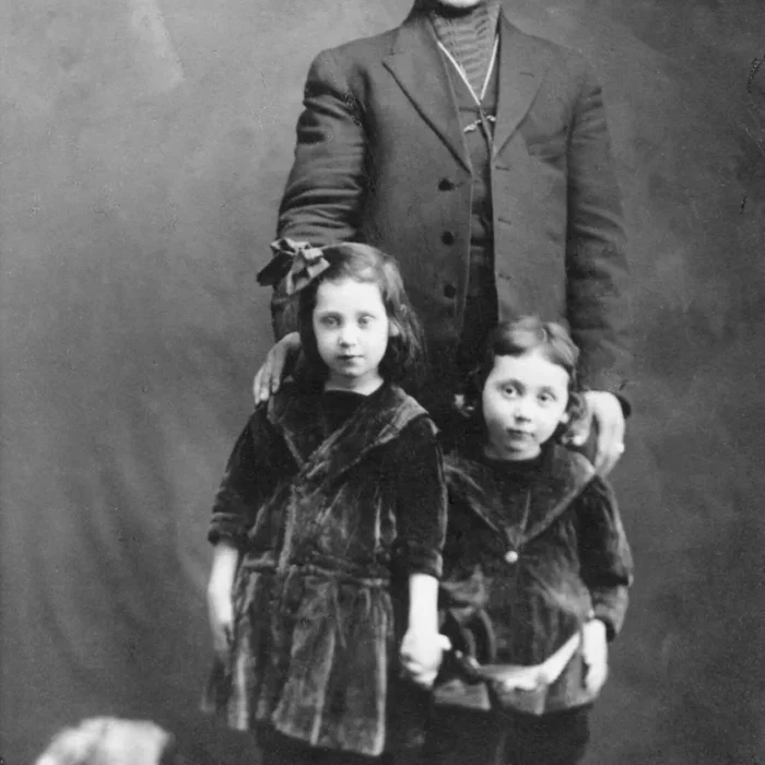 Black and white portrait of Harry Rifkin and his two daughters