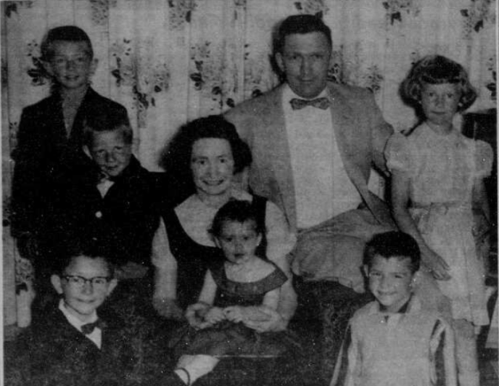 Black and white portrait of Alice and 6 kids