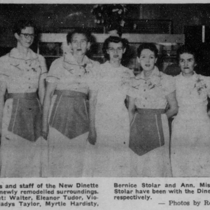 Black and white featured picture of the owners and staff of the Dinette