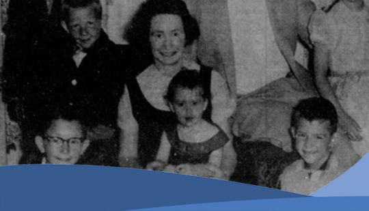 Black and white picture of a women and children posing