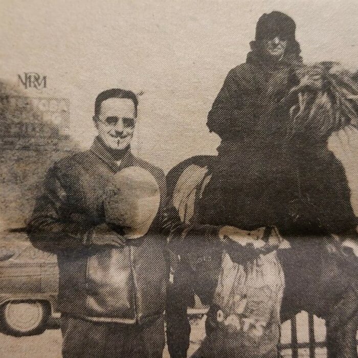 Horses Used to Haul Ignots from the Mill, 1946, Selkirk Enterprise Centennial Edition Two people posting for a photo. One is on a horse, the other is holding a helmet and a bag of oats