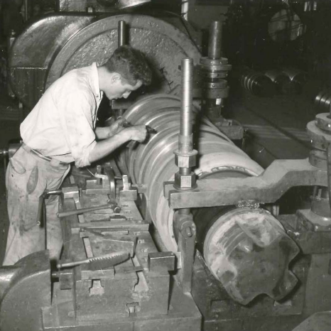 Turning Rolls Mechanical Improvements to Protect Operate Safety, Date Unknown, Gerdau Black and white depiction of a man working at the rolling mills