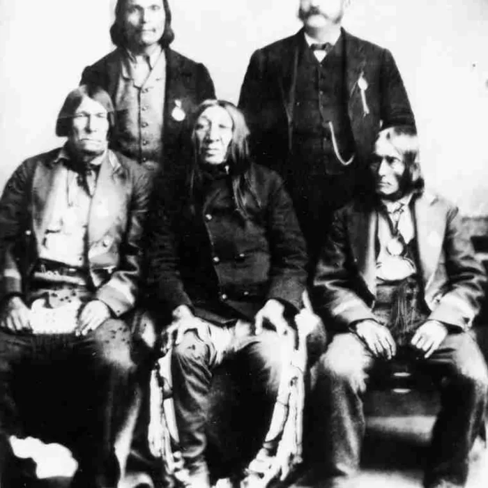 Le Sonnant Kahkewistahaw in the Center, c1886, University of Saskatchewan Library Archives and Special Collections Black and white portrait of Le Sonnant Kahkewistahaw in 1886