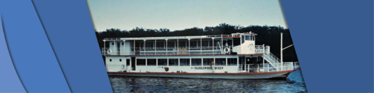 The paddlewheel queen ship on the water