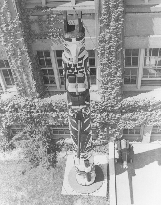 The Hosagami totem pole standing tall in front of a building