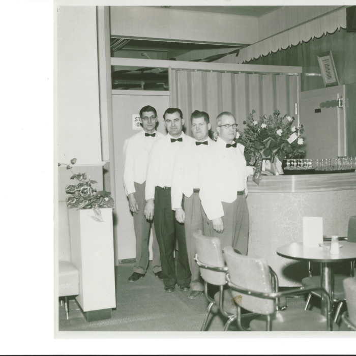 Nicholas and Theordore Jaworski and Others, 1951, Maureen Wallace Four men standing in a foyer of a hotel wearing white tuxedos