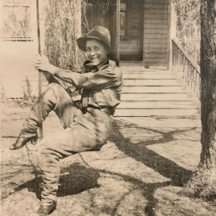 Young Ruth Hooker on a tree swing outside family home, Date Unknown, Joen Hadfield A young Ruth Moody on a swing hanging from a tree outside the Moody house