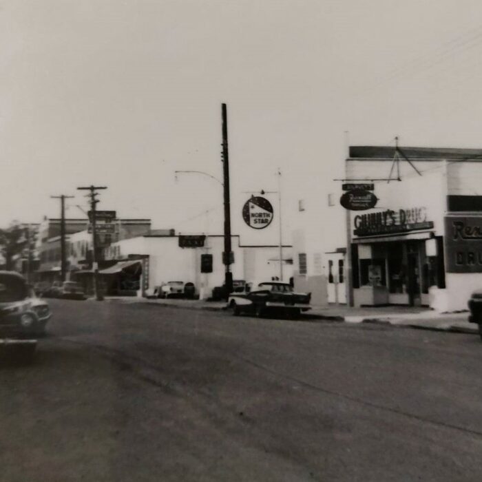 Gilhuly's Drug Store, 1950s, Selkirk Museum Collection Black and white street view of the outside of Gilhuly's Drug Store in the 1950s.