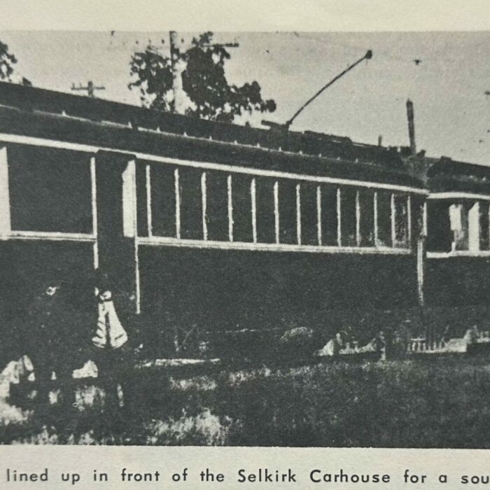 Electric train cars lined up in front of the car house in Selkirk MB.