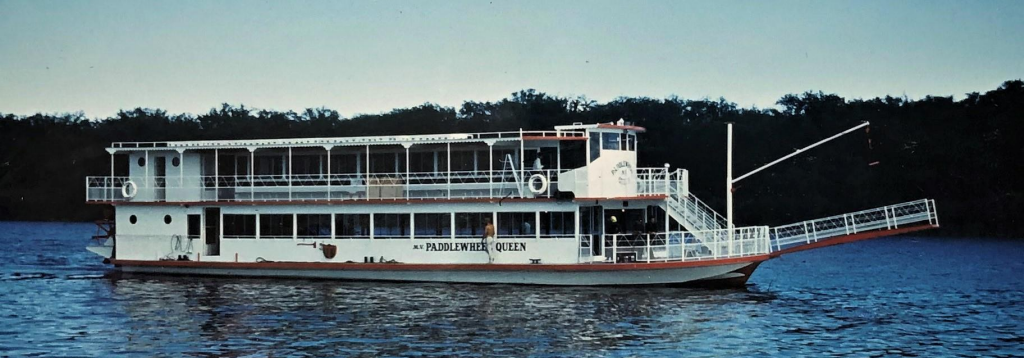 Colour image of Paddlewheel Queen in water.