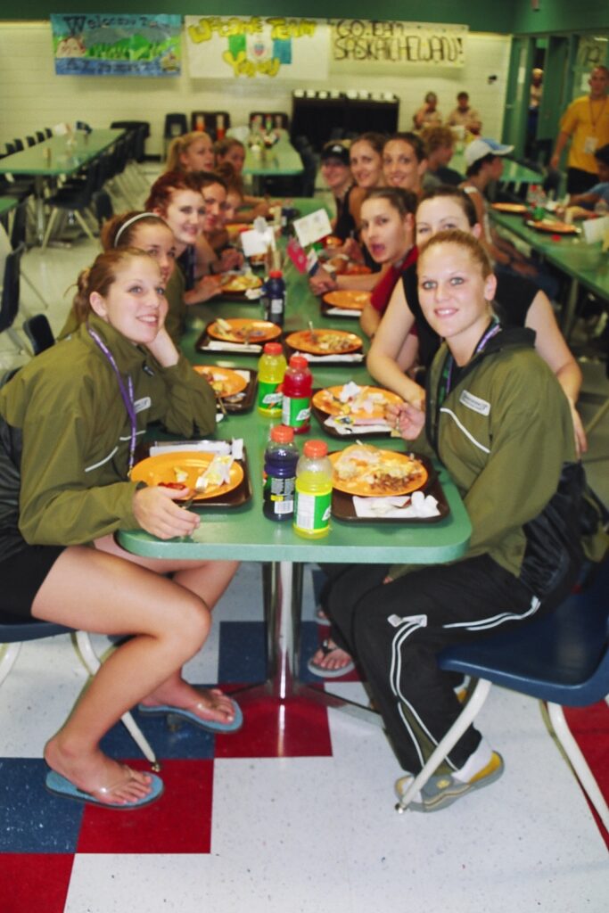 Athletes eating a meal at the Selkirk Comp