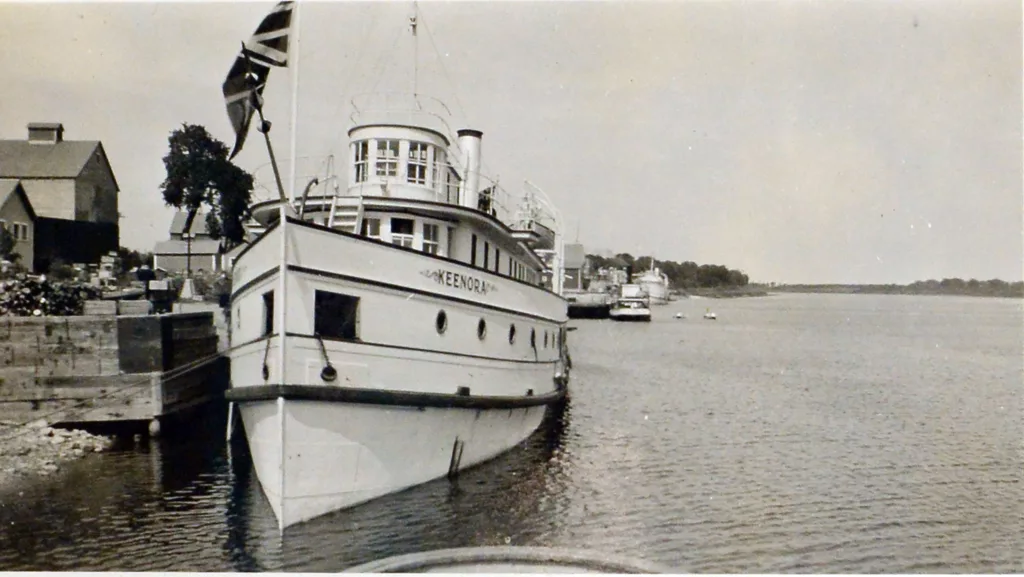 Black and white image of boat in water