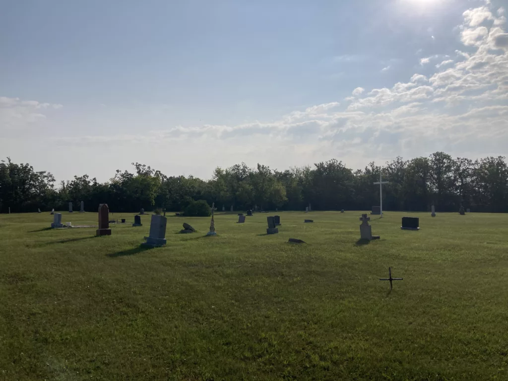 Photo of headstones in a field.