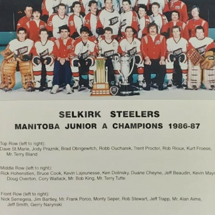 Group of hockey players wearing red Selkirk Steelers jerseys, Description below them reads 'Selkirk Steelers Manitoba Junior A Championship 1986-1987
