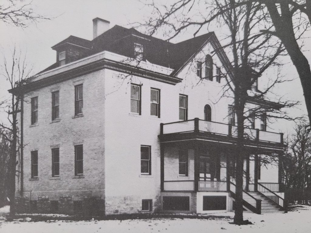 Selkirk General Hospital front and side exterior. The building is two three floors with a balcony on the second.