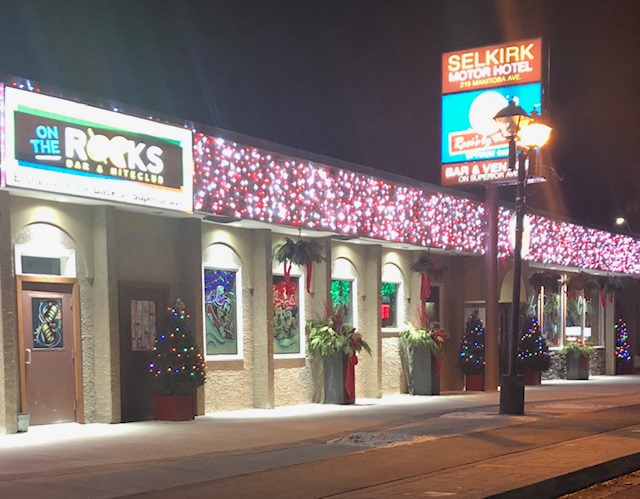 Colour photo of outside of restaurant, which is covered in Christmas Lights