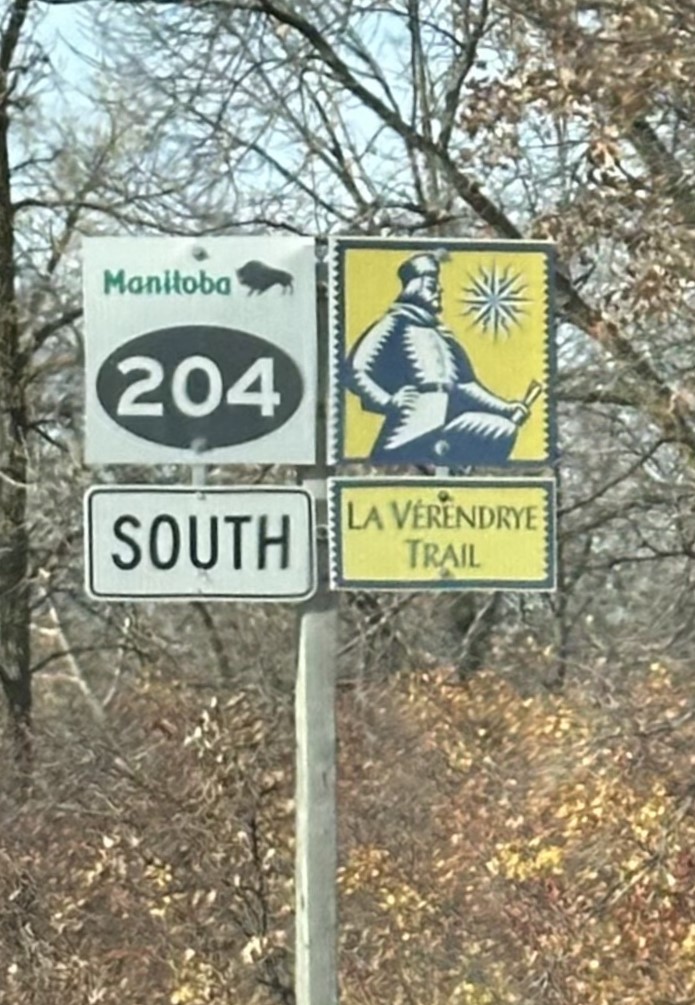 Image of a road sign, sign on the left says 204 south, sign on the right says La Vérendrye Trail