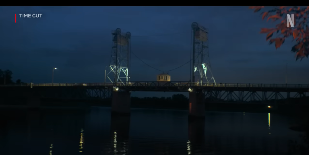 Image of the Selkirk Lift Bridge at night. The bridge is dimly lit