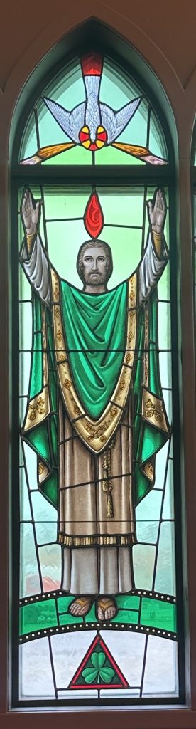 Peter is shown in the center of the image wearing green robes