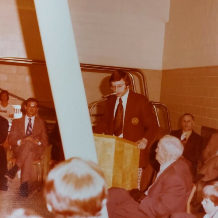 Gary Mowat at Selkirk Community Pool Opening, 1975, Kinsmen Scrapbook Selkirk Musuem Collection Gary Mowat at Selkirk Community Pool Opening speaking at a podium