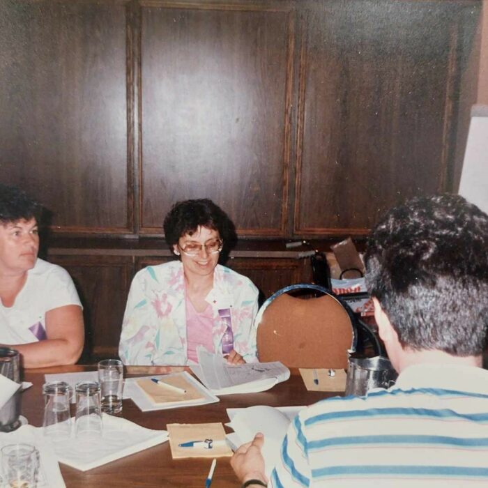 Pat Croy and Lori Weatherby on Left, 1987, Michelle Stamm Pat Croy and Lori Weatherby on Left siting at a table with papers in front of them