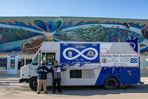 This is  a photo of The Metis Music Van, with blue and white colors for the metis flag
