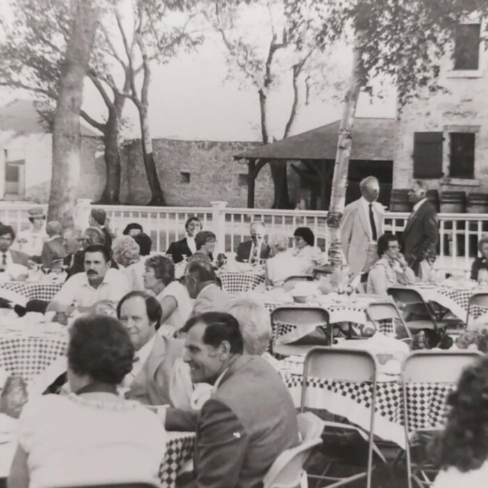 Governors Dinner at Lower Fort Garry, 1982, Selkirk Museum Collection Black and white image of the Governors Dinner at Lower Fort Garry. Image shows people dressed in formal attire and seated at tables in the yard