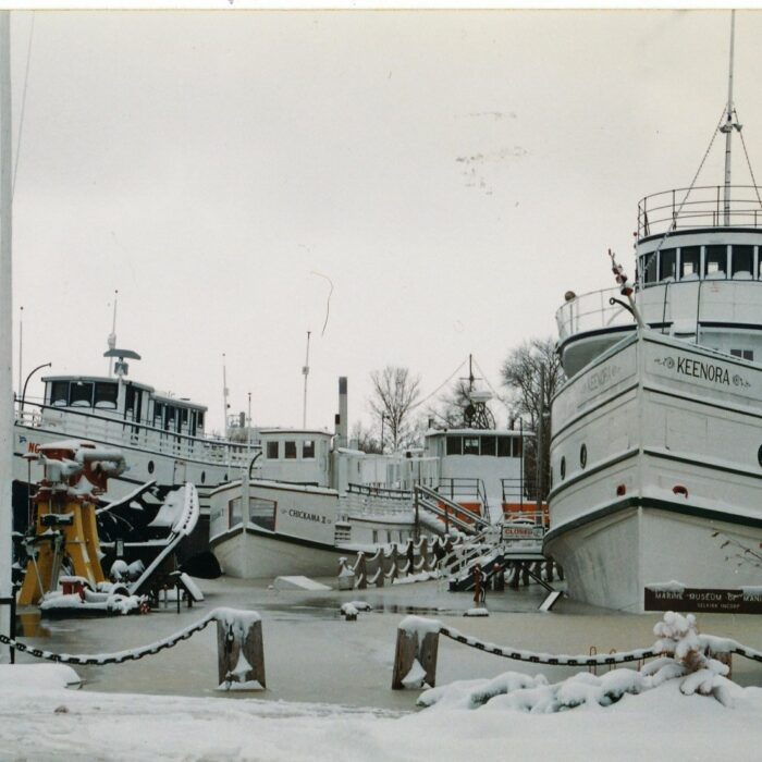 Marine Museum Flood, 1996, Fraser Stewart Colour photograph of the Marine Museum in the early spring right after a flood. The water has frozen around the ships