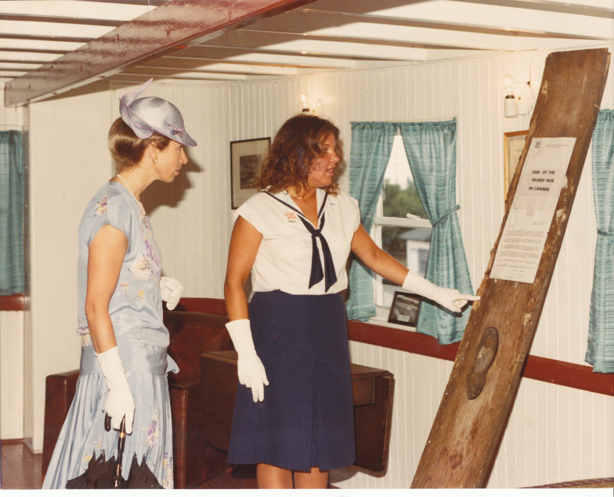 Colour image of Princess Ann and Nancy Noron. Nancy is showing the Princess a display