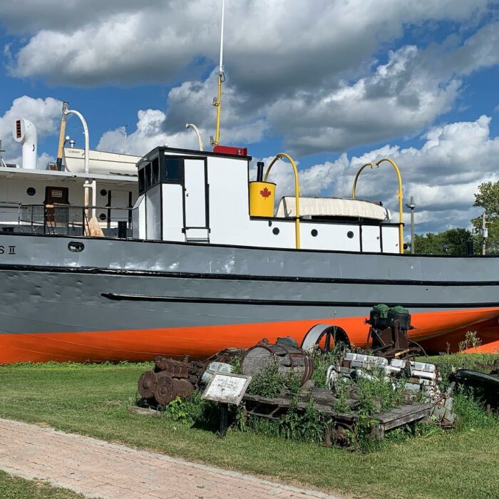 Peguis II, 2020, Marine Museum of Manitoba Colour photograph of the Peguis II. The boat is grey and orange, which matches the Bradbury