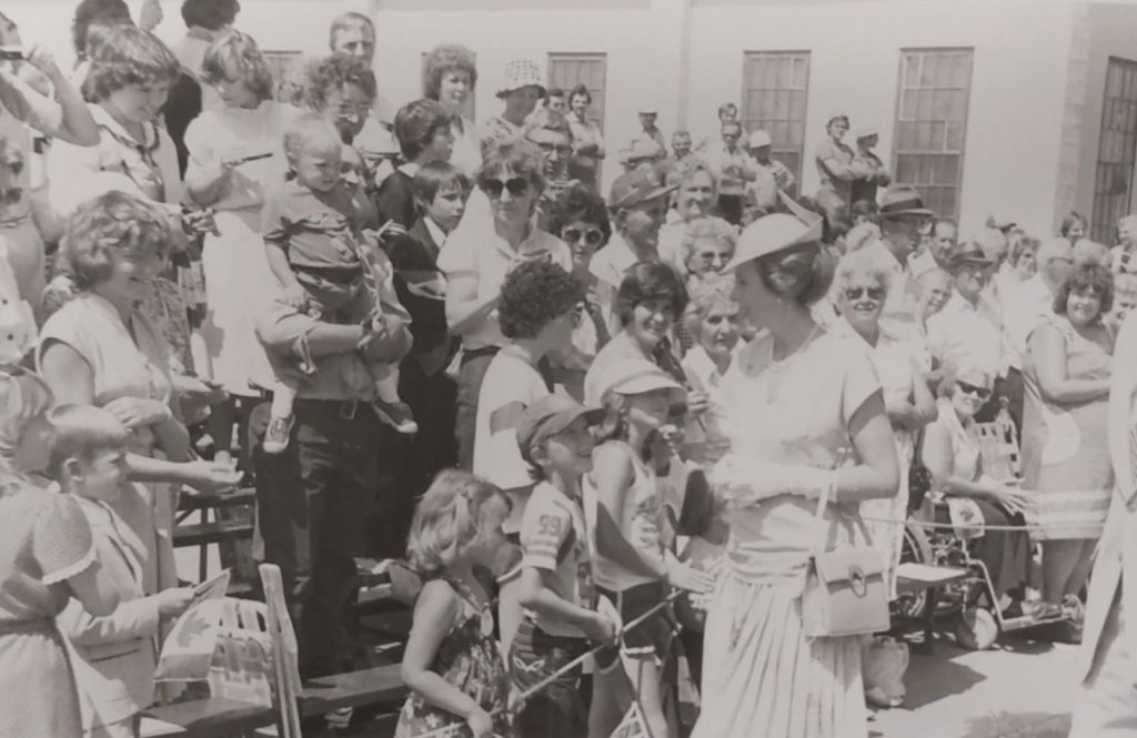 Black and white image of Princess Ann meeting Selkirk citizens along the street