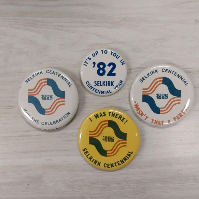 Selkirk Centennial Pins, 1982, Selkirk Museum Collection Image shows the variety of different Selkirk Centennial pins