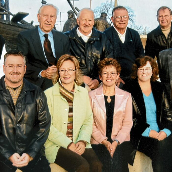 Front Michael Buhr, Bev Clegg, Leslie Hanson, Russ Skalesky, Front, Tob Cox, Joe Smolinski, Ray Anderson, Bud Oliver, Otto Gebhardt, 2006, Selkirk District Community Foundation A group of people sitting outside pose for a picture. They are wearing jackets and scarves