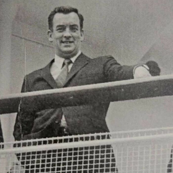 Mac MacFarlane on the MS Lord Selkirk, Date Unknown, According to Me by Dawn Anderson MacFarlane Black and white image of a man standing on a boat deck. His hand rests on the rail
