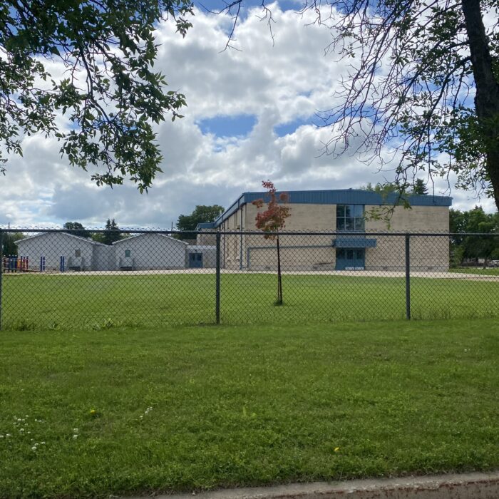 Playground of Selkirk Centennial School, 2024, Selkirk Museum Collection Colour image of a school playground and grassy field